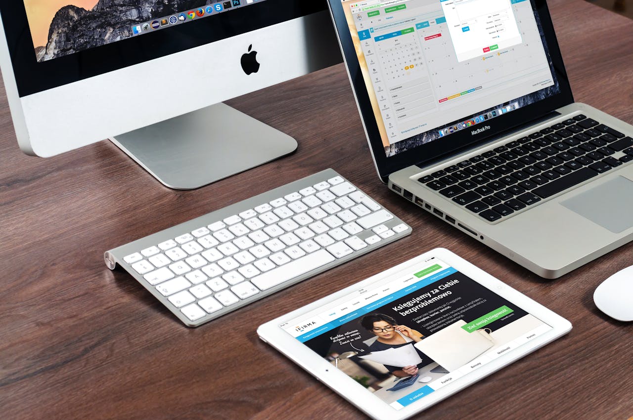 Crafting Captivating Headlines: Your awesome post title goes here A sleek office desk setup featuring Apple devices: iMac, MacBook, and iPad.